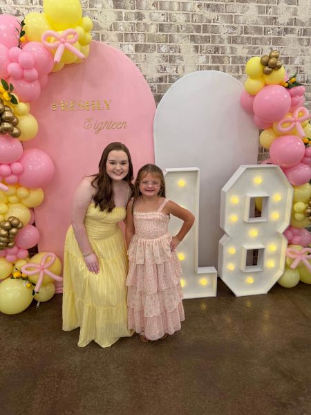 This photo features our custom "Freshly Eighteen" birthday installation, showcasing a pink and yellow balloon garland, arched backdrop, and illuminated marquee "18" numbers. We designed this setup to create a vibrant, celebratory focal point for milestone birthday photography. It highlights our ability to curate cohesive color palettes and professional event décor that elevates a client's special occasion.